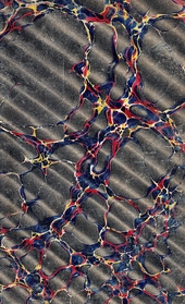 grey, red and gold rippled marbled endpaper